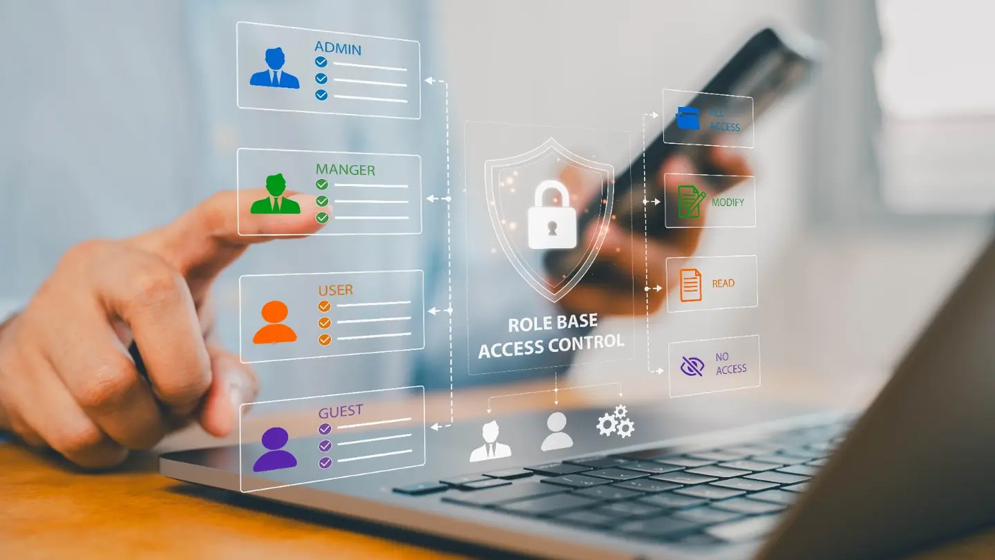 Microsoft 365 role-based access controls displayed on a laptop