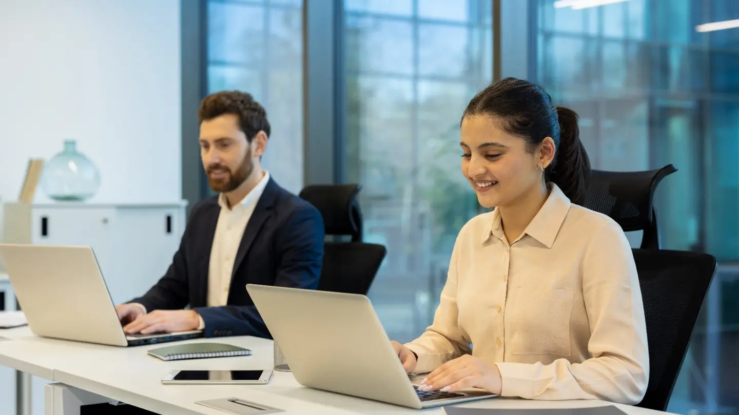 Employees working productively on business laptops